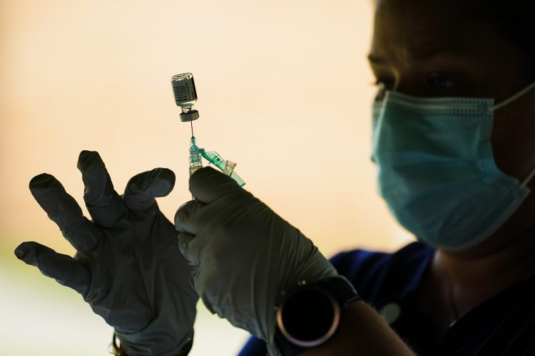 CDC panel grapples with who needs a COVID-19 booster shot